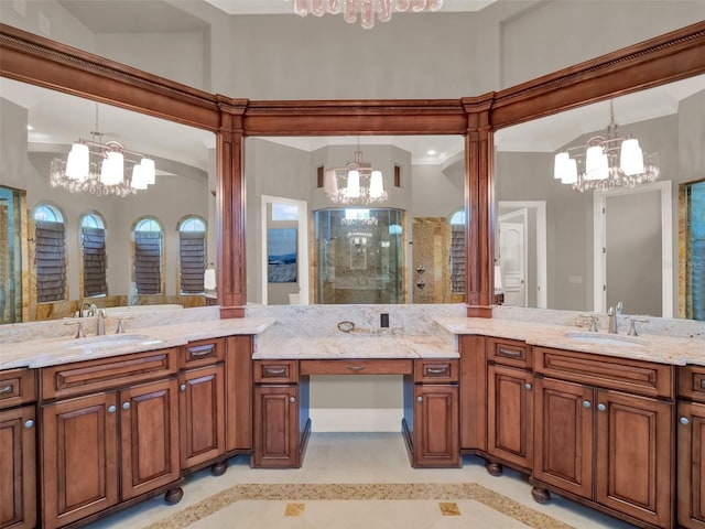 full bathroom featuring a stall shower, a notable chandelier, and vanity