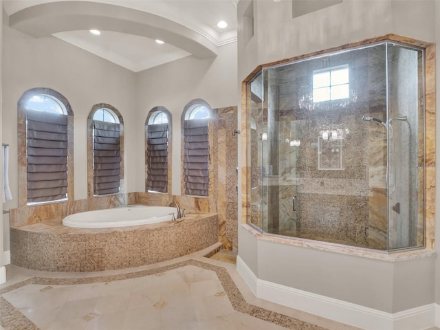 bathroom featuring a garden tub, recessed lighting, crown molding, and tiled shower