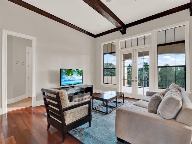 living room with french doors, beam ceiling, crown molding, wood finished floors, and baseboards