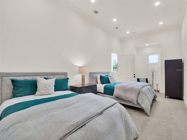 bedroom with light carpet, baseboards, visible vents, and recessed lighting