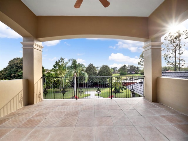 view of patio featuring a balcony and a ceiling fan