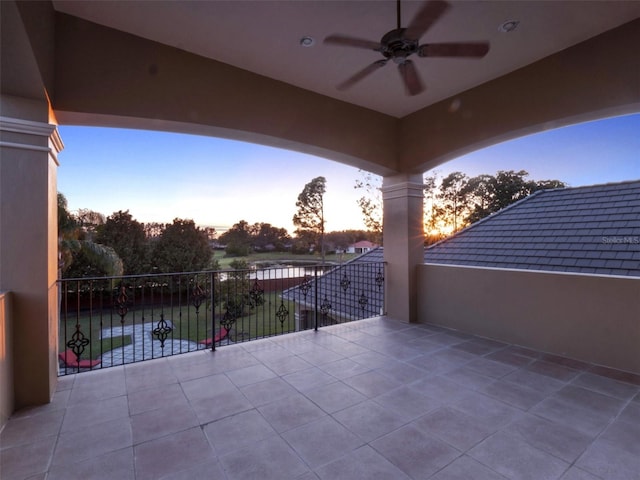 view of patio / terrace featuring ceiling fan and a balcony