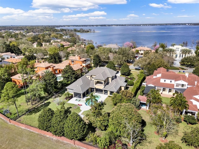 bird's eye view featuring a water view and a residential view