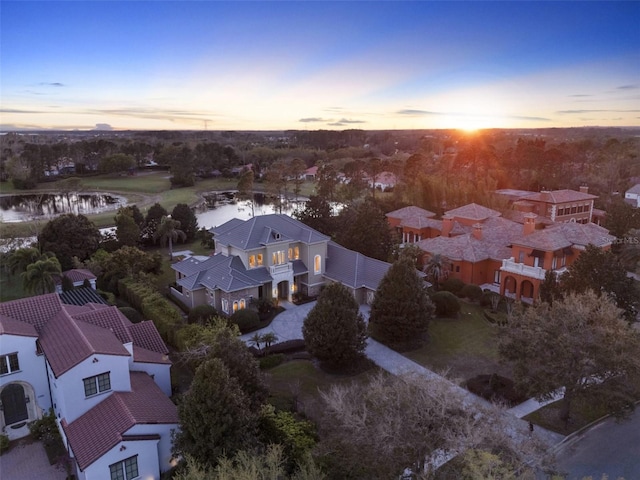 birds eye view of property featuring a water view and a residential view