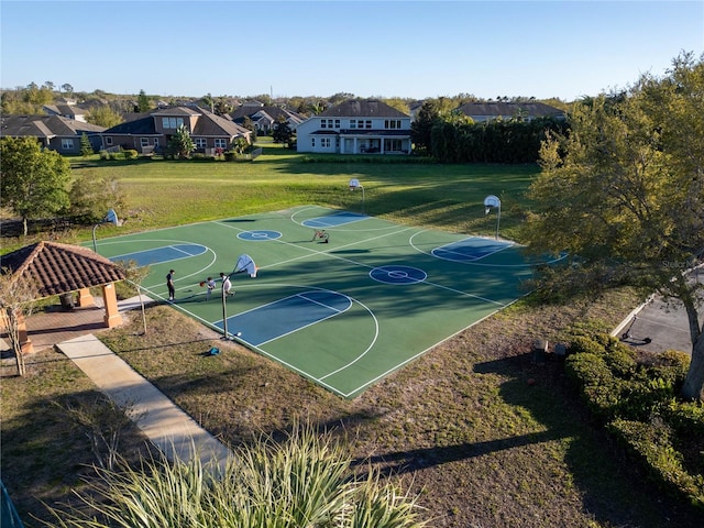 view of basketball court featuring community basketball court, a lawn, a gazebo, and a residential view