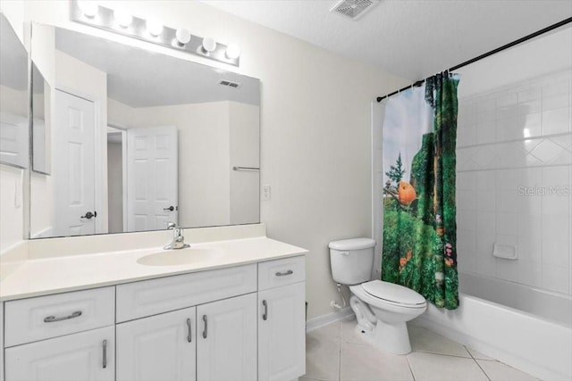 full bathroom with toilet, vanity, visible vents, and tile patterned floors