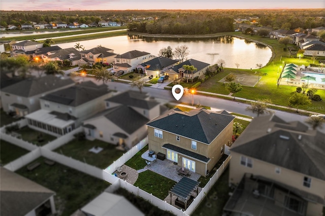 aerial view with a residential view and a water view