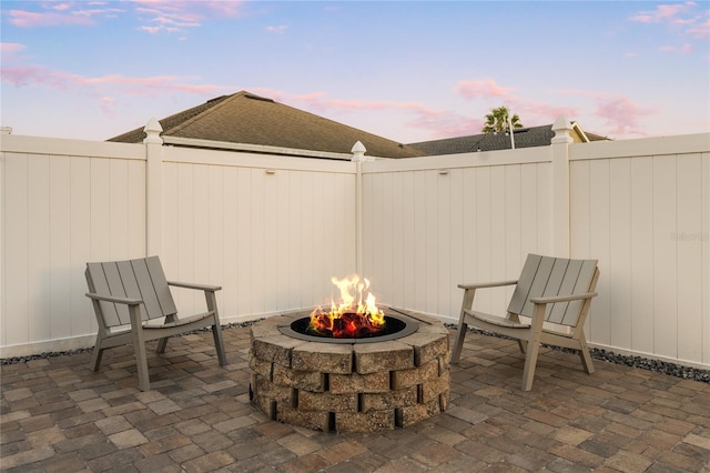 view of patio / terrace with a fenced backyard and a fire pit