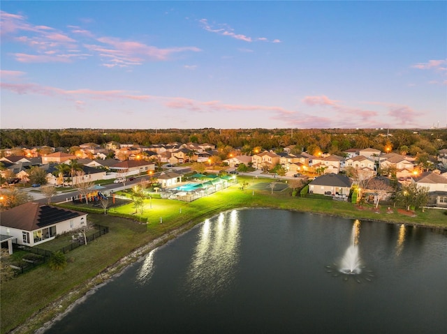 aerial view with a residential view and a water view