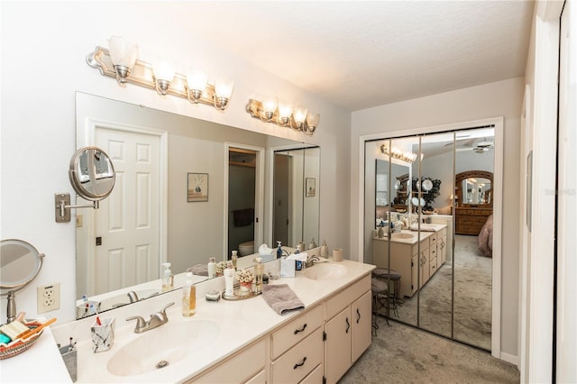 full bathroom featuring a sink, ensuite bathroom, and double vanity