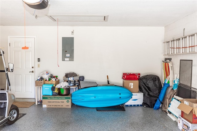 garage with electric panel and a garage door opener