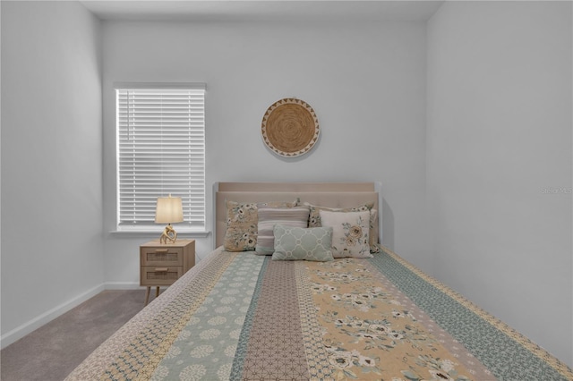 unfurnished bedroom featuring carpet flooring and baseboards