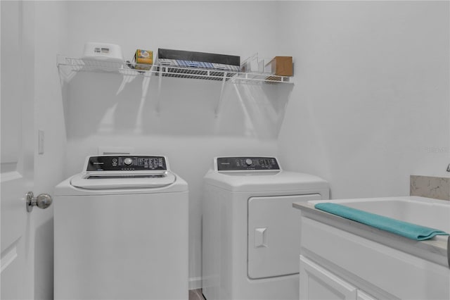 washroom featuring laundry area and washer and clothes dryer