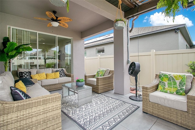 sunroom / solarium featuring ceiling fan