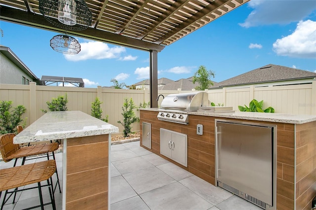 view of patio featuring a fenced backyard, grilling area, area for grilling, and a pergola