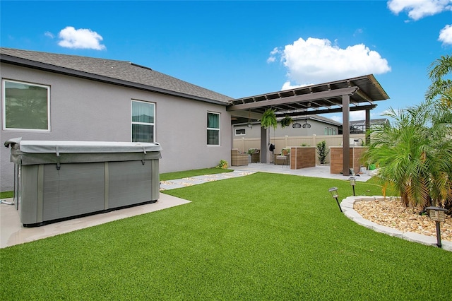 back of house with a hot tub, fence, a yard, a pergola, and stucco siding