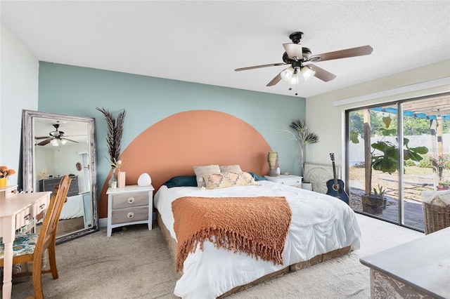 carpeted bedroom featuring ceiling fan and access to outside