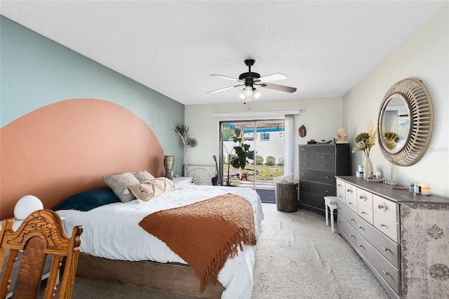 bedroom with access to exterior, a textured ceiling, a ceiling fan, and light colored carpet