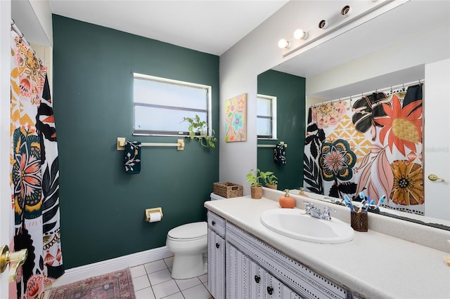 full bath with tile patterned flooring, baseboards, vanity, and toilet