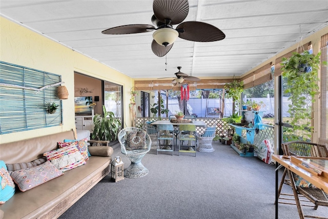 sunroom featuring a ceiling fan