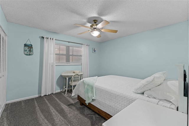 carpeted bedroom featuring a ceiling fan, baseboards, and a textured ceiling