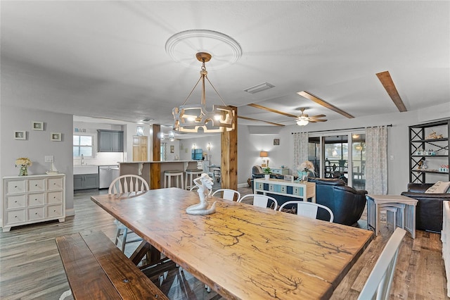 dining area featuring wood finished floors, visible vents, and ceiling fan