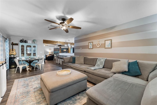 living room with ceiling fan and wood finished floors