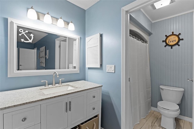 full bath featuring baseboards, toilet, and vanity