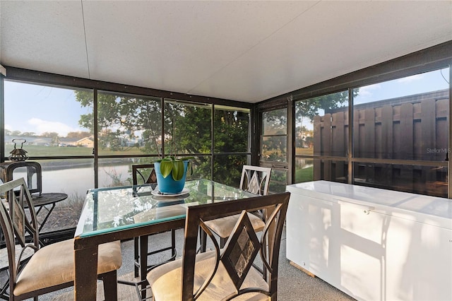 sunroom with a water view