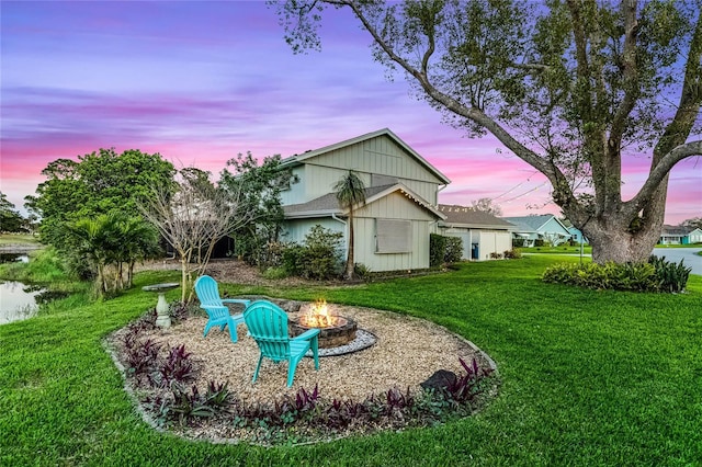 view of yard featuring an outdoor fire pit