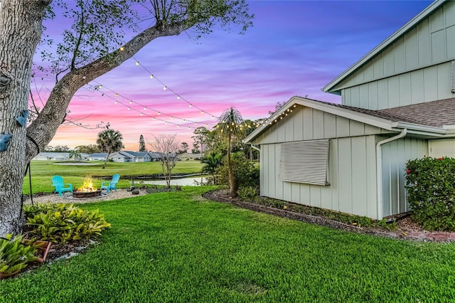 view of yard with an outdoor fire pit