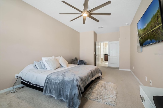 bedroom with ceiling fan, carpet flooring, visible vents, baseboards, and vaulted ceiling