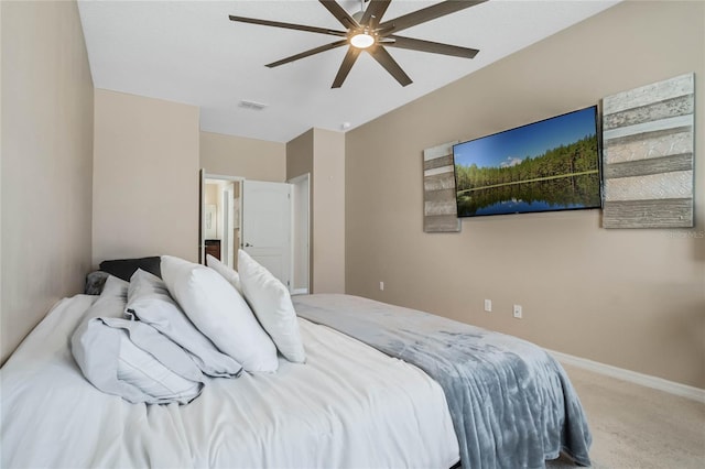 carpeted bedroom with visible vents, ceiling fan, and baseboards