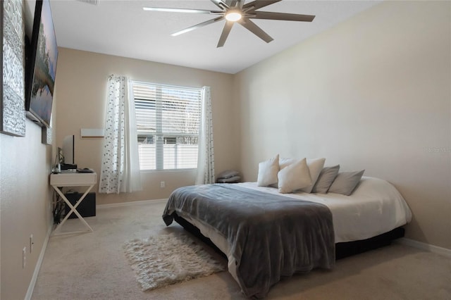 bedroom with ceiling fan, carpet floors, visible vents, and baseboards