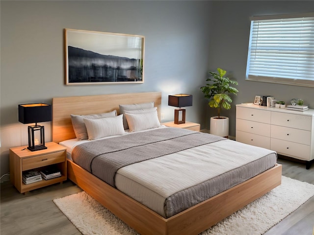 bedroom with wood finished floors