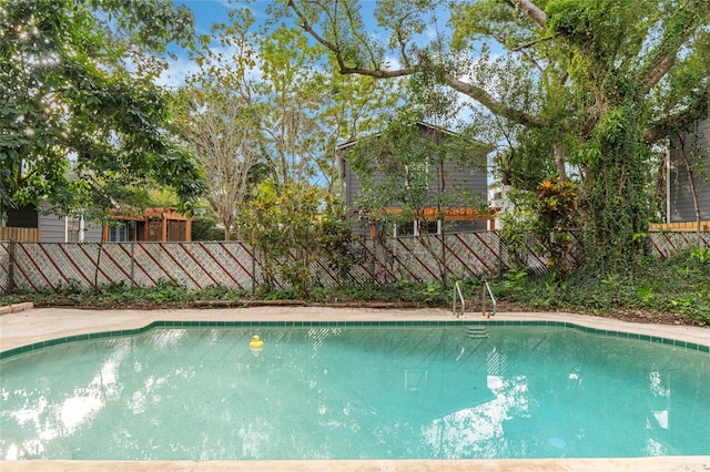 view of pool featuring a fenced in pool and a fenced backyard