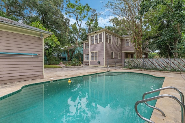 view of pool with fence, a fenced in pool, and a patio