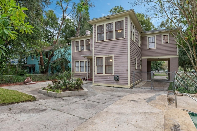 view of front of property with a gate and fence