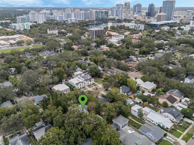 birds eye view of property with a city view and a water view