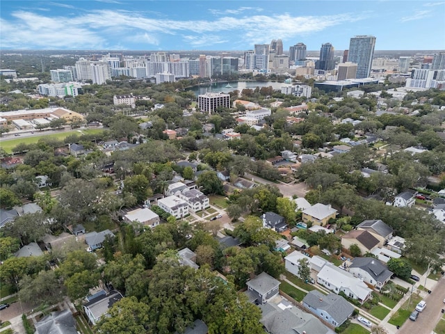 birds eye view of property with a city view and a water view