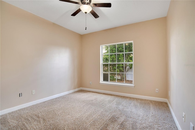 unfurnished room with carpet, ceiling fan, and baseboards