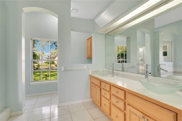 full bathroom featuring a sink and double vanity