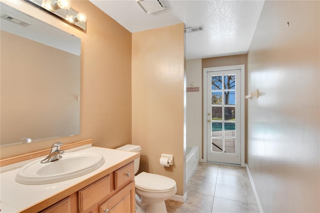 full bath with visible vents, a textured ceiling, toilet, and vanity