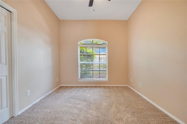 unfurnished room with carpet, baseboards, and ceiling fan