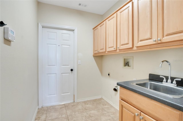 laundry area with hookup for a washing machine, a sink, visible vents, cabinet space, and electric dryer hookup