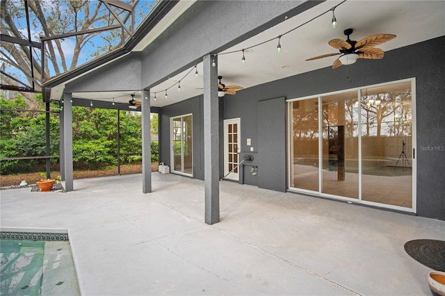 view of patio / terrace with glass enclosure and ceiling fan