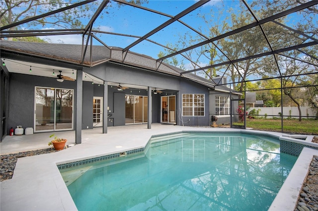 rear view of property with a patio area, fence, and ceiling fan