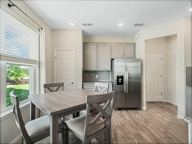 dining area with recessed lighting, baseboards, light wood-style floors, and visible vents