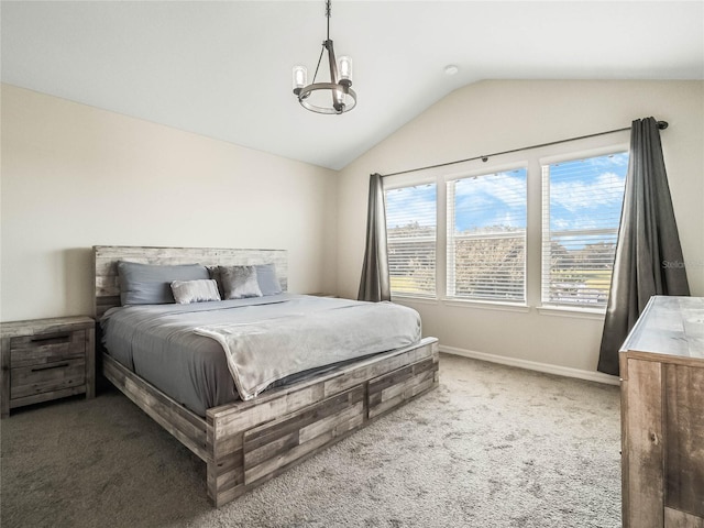 bedroom featuring carpet, baseboards, and vaulted ceiling