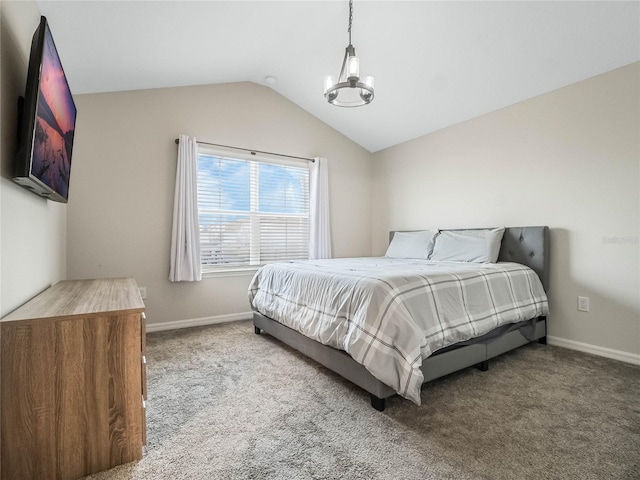 bedroom featuring baseboards, vaulted ceiling, carpet floors, and a chandelier